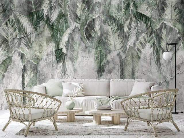 Fototapeta z dużymi zielonymi liśćmi na betonowym tle