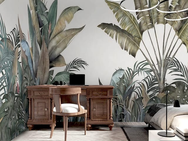 Fototapeta z dużymi tropikalnymi liśćmi bananowca na jasnym tle