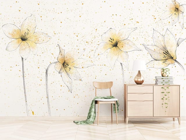 Fototapeta z delikatnymi liliami i złotymi plamkami na białym tle