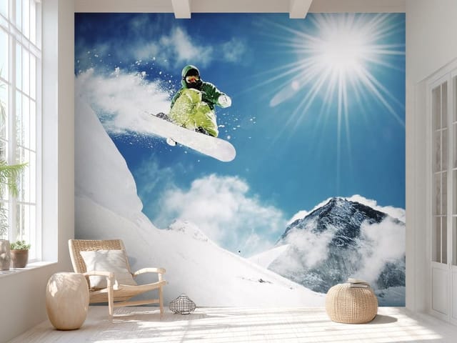 Fototapeta krajobrazy górskie – snowboardzista w zielonym stroju