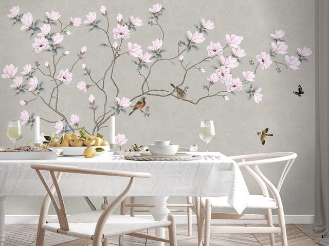 Fototapeta Magnolie – gałąź magnolii z delikatnymi różowymi kwiatami na jasnym, szarym tle