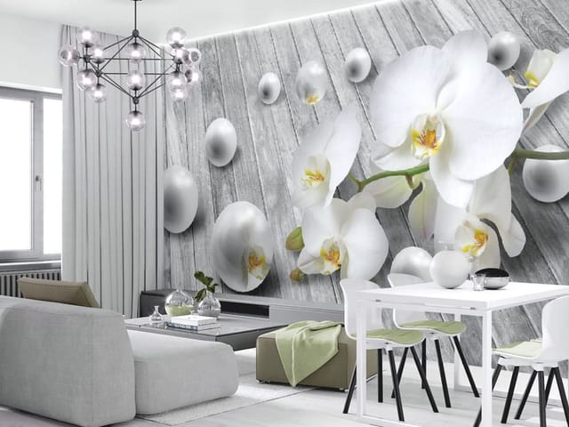 Fototapeta z białymi orchideami na tle szarych desek z perłowymi kulami