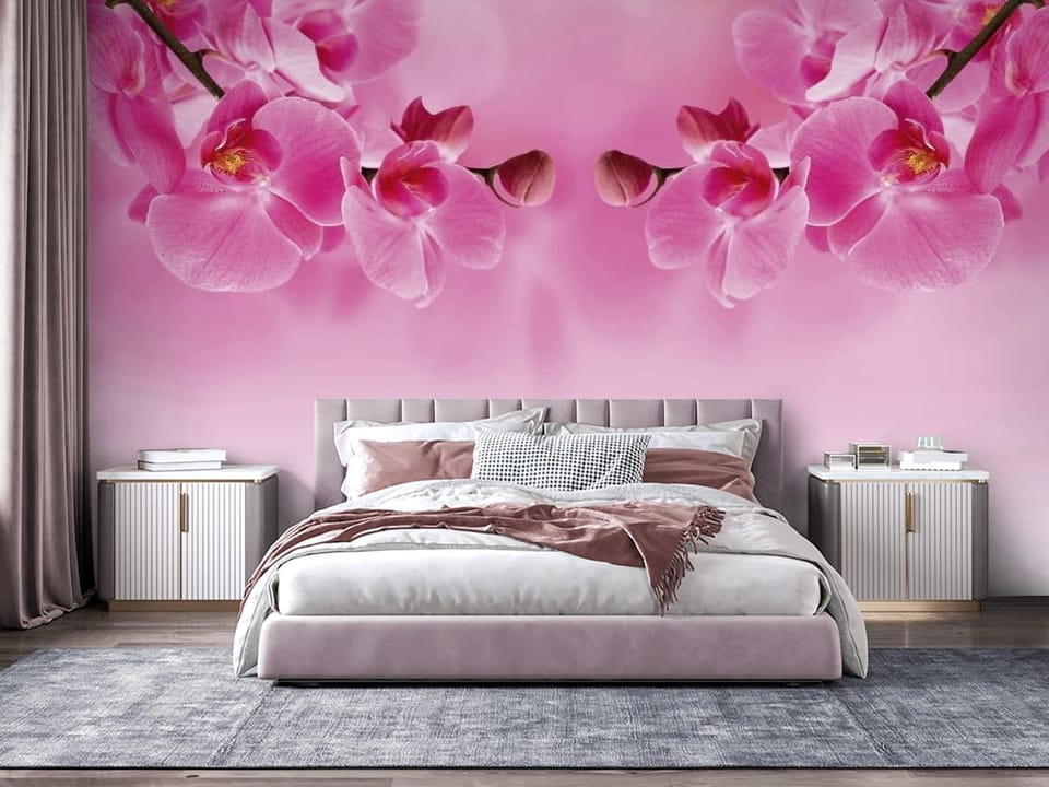 Fototapeta z różowymi kwiatami orchidei na gałęzi, różowe rozmyte tło - nowoczesna aranżacja za łóżkiem w sypialni