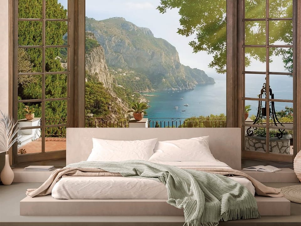 Fototapeta Widok na morze przez okno we wnętrzu sypialni