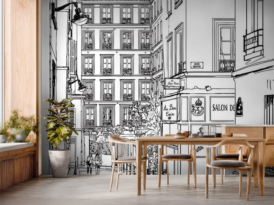 Fototapeta z wąską ulicą, wysokimi kamienicami i szyldem kawiarni - inspiracja do strefy jadalnianej w kuchni
