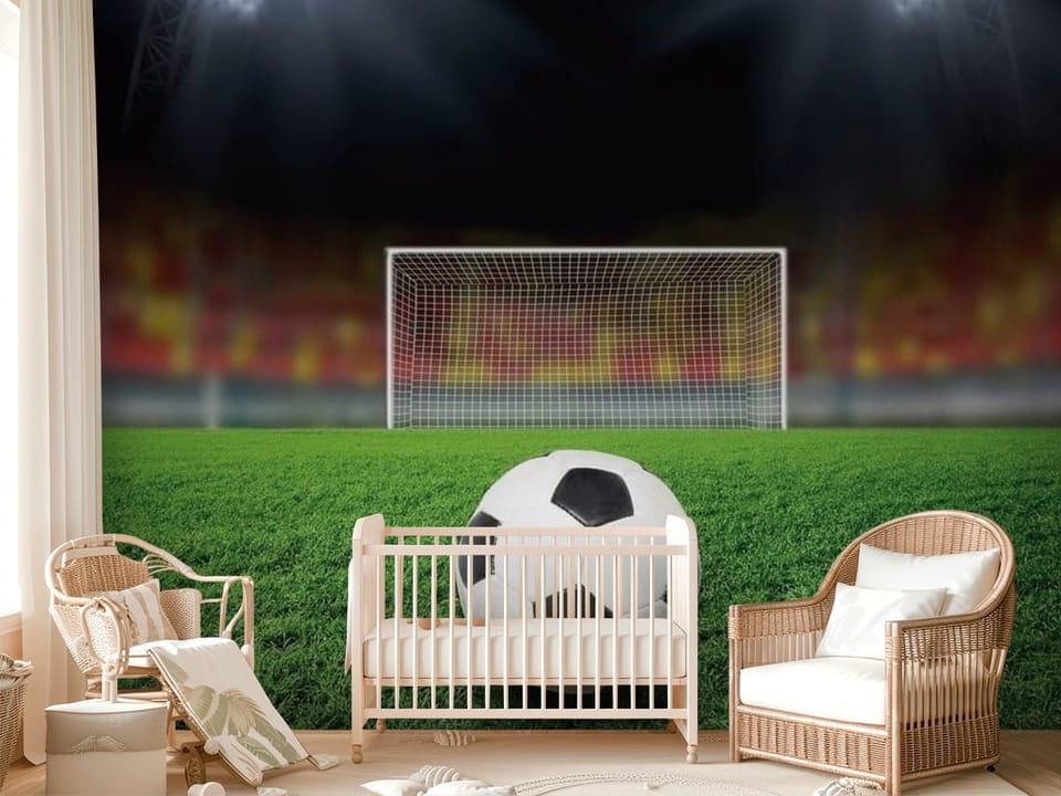 Fototapeta z piłką nożną na murawie stadionu z bramką i trybunami - ściana w przytulnym pokoju dziecięcym