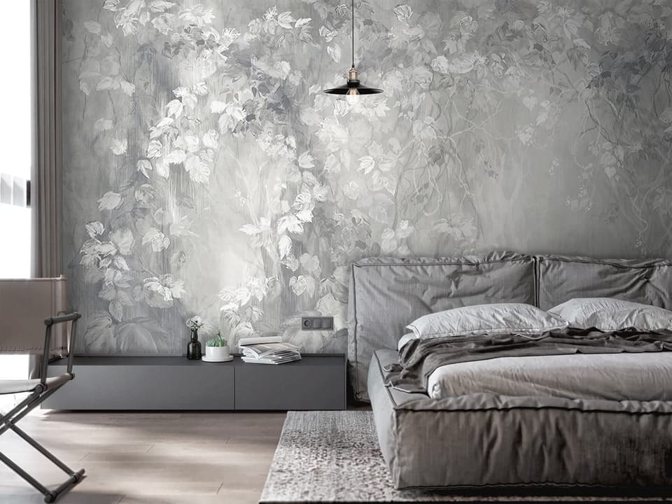 Fototapeta Gęste liście i pnącza w szarości we wnętrzu sypialni