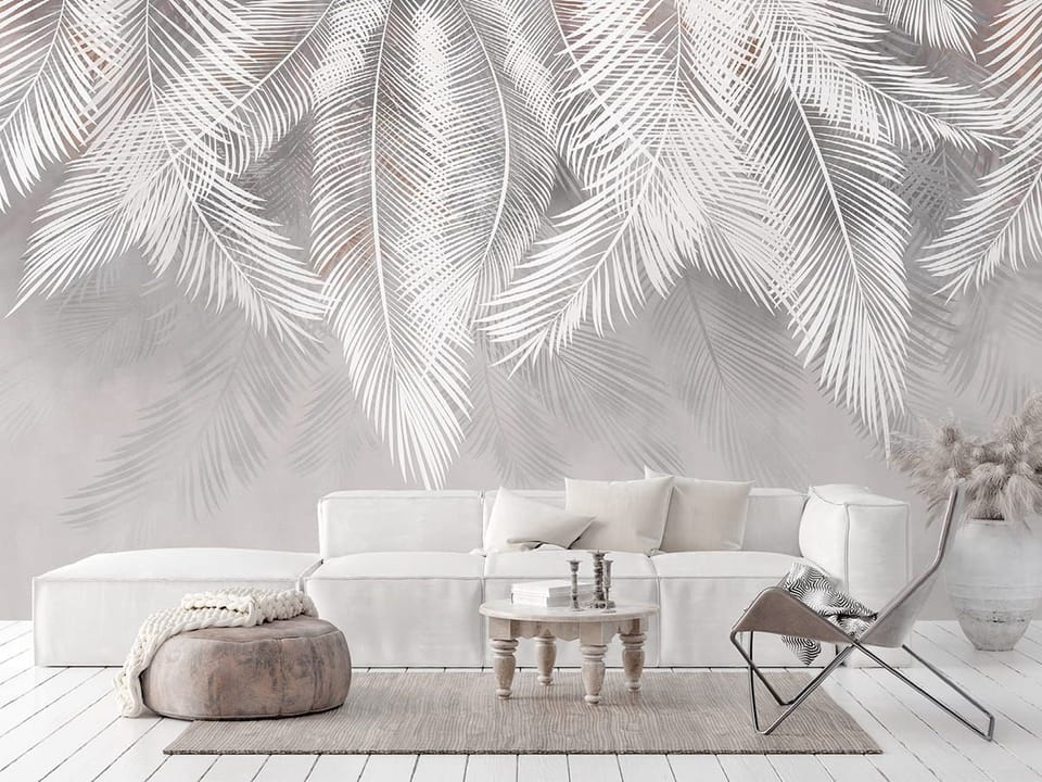 Fototapeta Białe liście palmowe na szarym tle we wnętrzu salonu