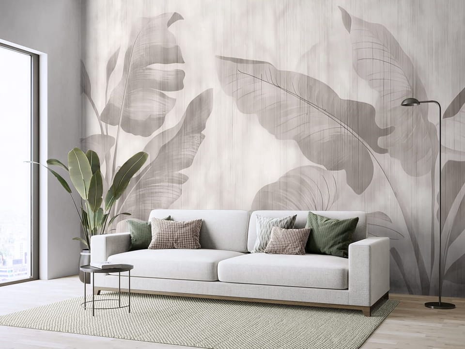 Fototapeta Tropikalne liście na jasnym tle we wnętrzu salonu