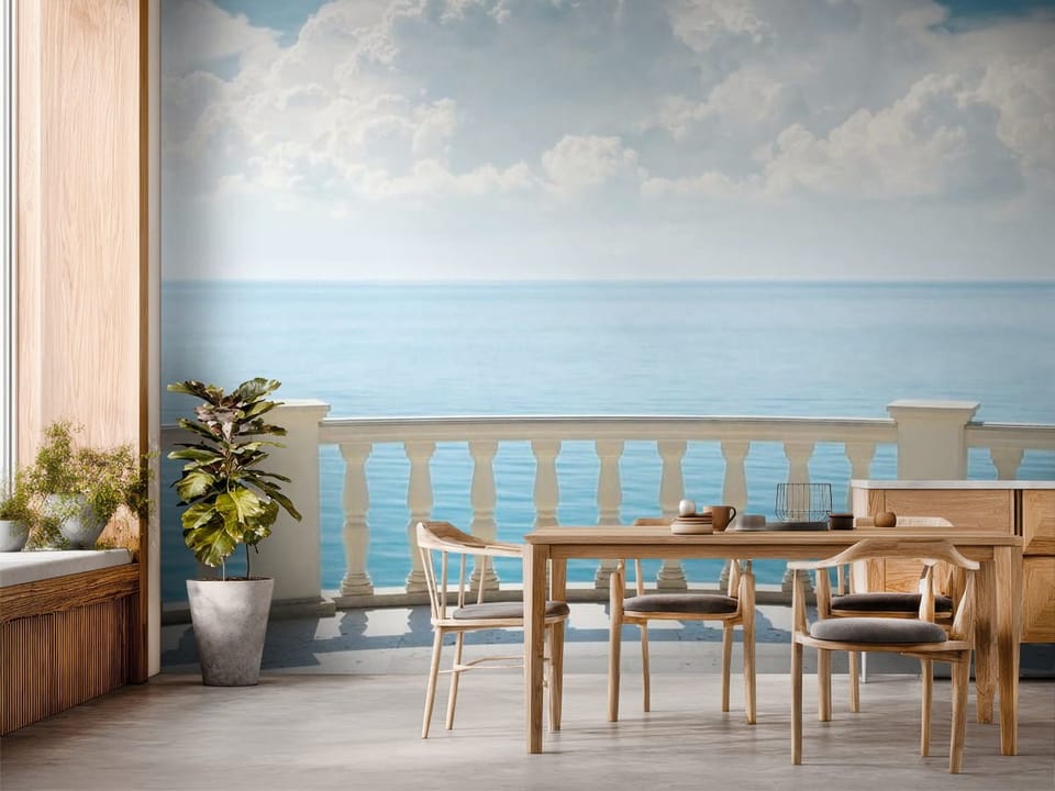 Fototapeta z balustradą i widokiem na spokojne morze i niebo - inspiracja do strefy jadalnianej w kuchni