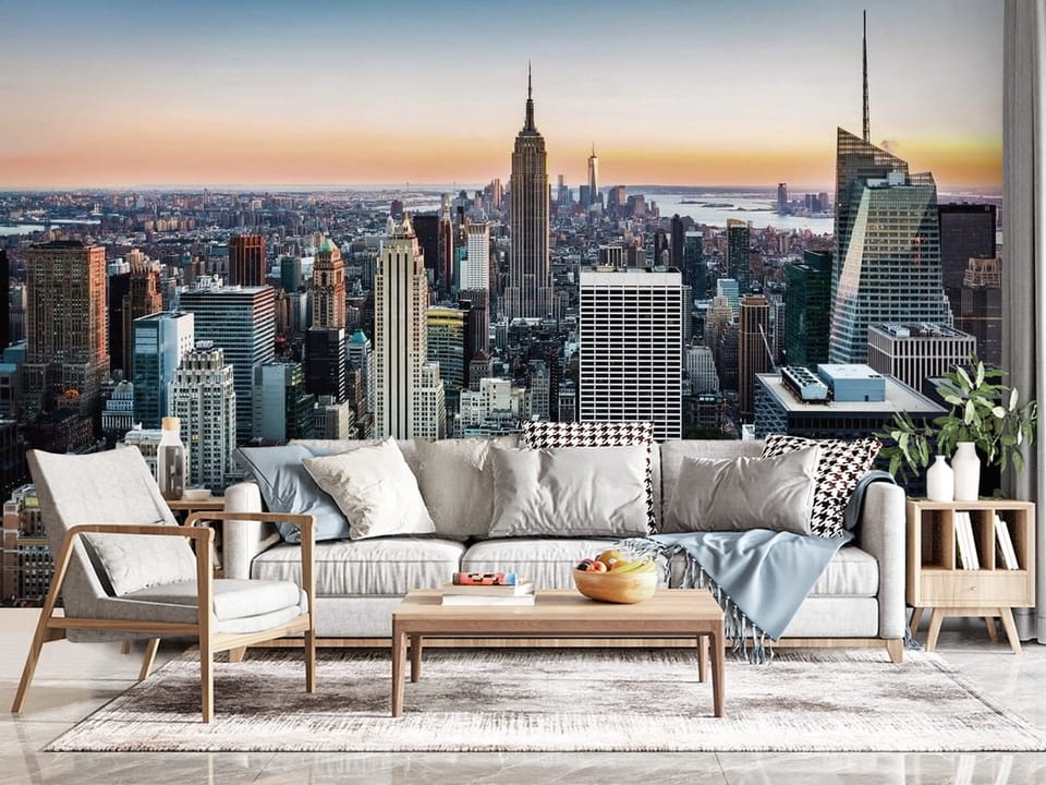 Fototapeta przedstawiająca panoramę miasta z wieżowcami i zachodem słońca - kompozycja ściany w przytulnym salonie