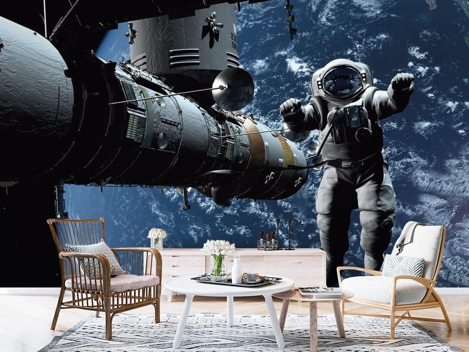 Fototapeta z astronautą w skafandrze, stacją kosmiczną i Ziemią - aranżacja przedpokoju w stylu skandynawskim
