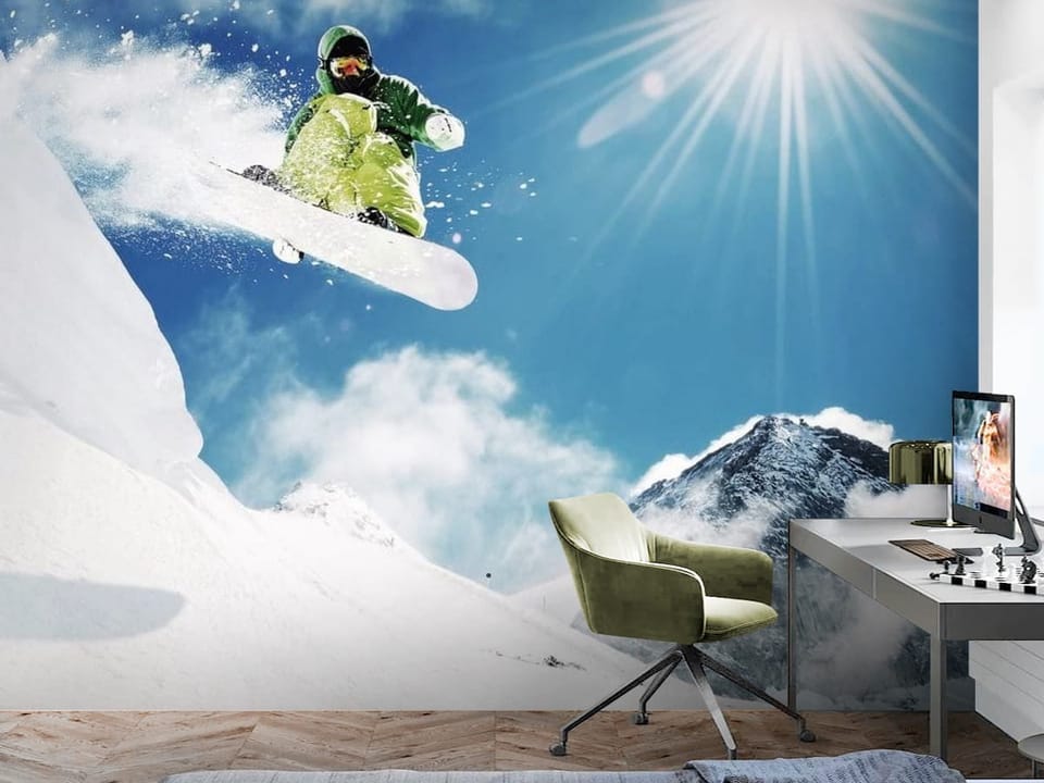 Fototapeta z snowboardzistą w zielonym stroju na tle gór - aranżacja w minimalistycznym pokoju nastolatka