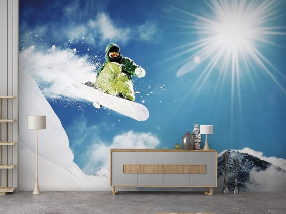 Fototapeta z snowboardzistą w zielonym stroju na tle gór - przedpokój w bloku z pomysłowym wnętrzem