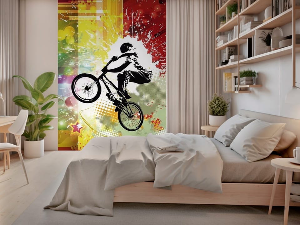 Fototapeta z rowerzystą skaczącym na rowerze na kolorowym tle z abstrakcyjnymi wzorami - piękna aranżacja w sypialni