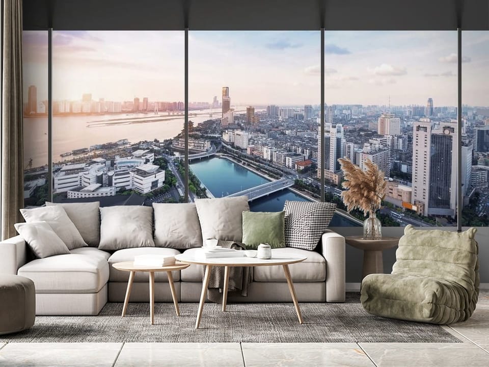 Fototapeta z panoramą miasta, rzeką i mostem w tle - nowoczesny salon z różnymi dodatkami