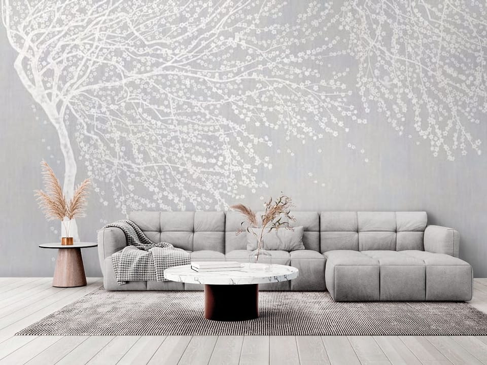 Fototapeta z białymi gałęziami drzewa i delikatnymi kwiatami na jasnym tle - elegancki salon w stylu minimalistycznym