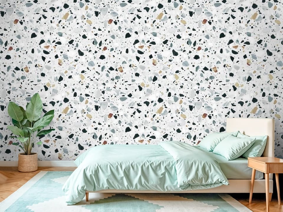 Fototapeta z wzorem terrazzo, różnokolorowe kamienie na białym tle - piękna inspiracja do sypialni
