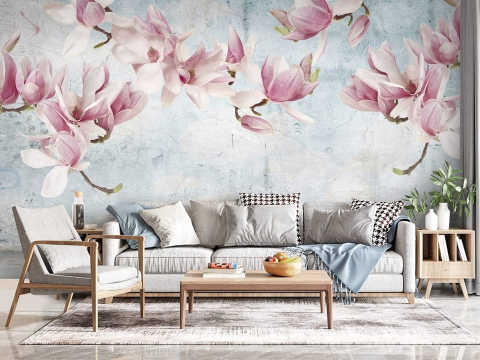 Fototapeta z kwiatami magnolii na gałęziach i panoramą miasta - kompozycja ściany w przytulnym salonie