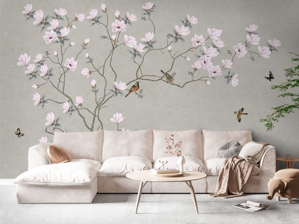 Fototapeta z gałęzią magnolii i różowymi kwiatami na szarym tle - widok na ścianę w eleganckim salonie