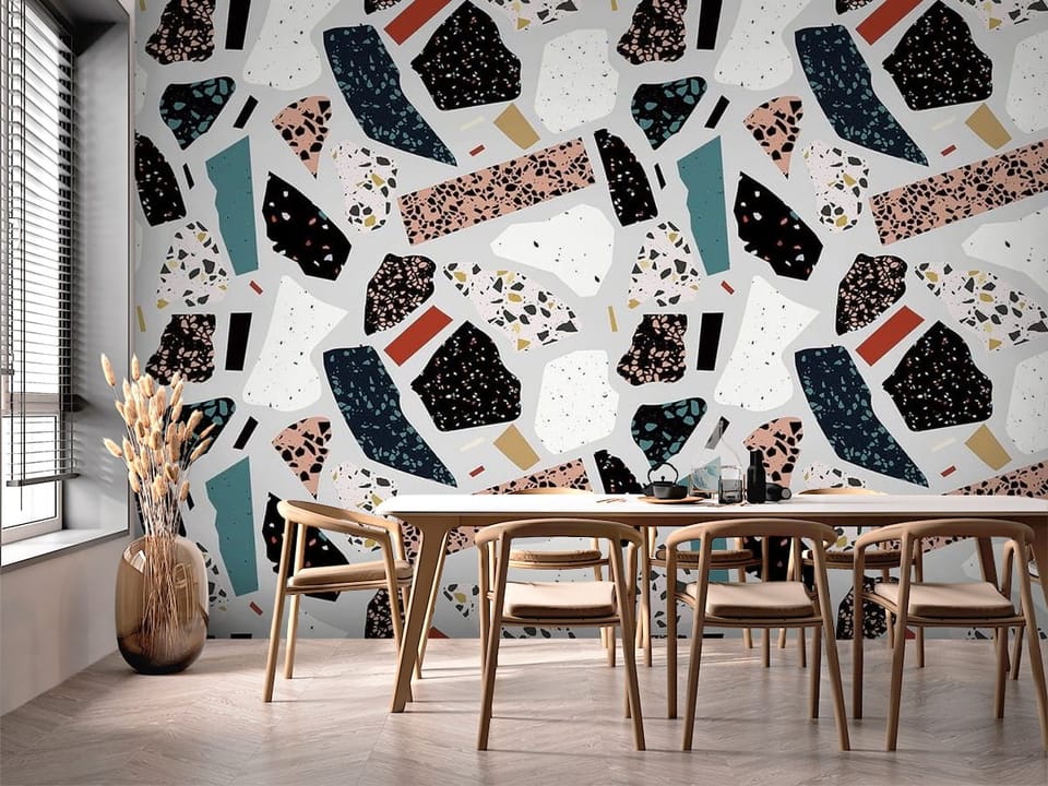 Fototapeta z abstrakcyjnymi kolorowymi kształtami w stylu terrazzo - ściana przy stole jadalnianym w kuchni