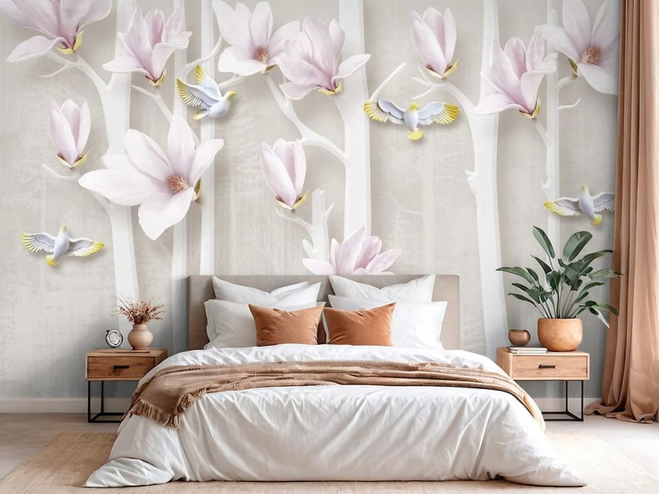 Fototapeta z różowymi kwiatami magnolii na białych gałęziach - pomysłowe wykończenie jasnej sypialni