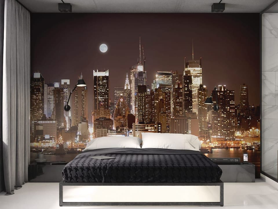 Fototapeta Nocna panorama z wieżowcami we wnętrzu sypialni