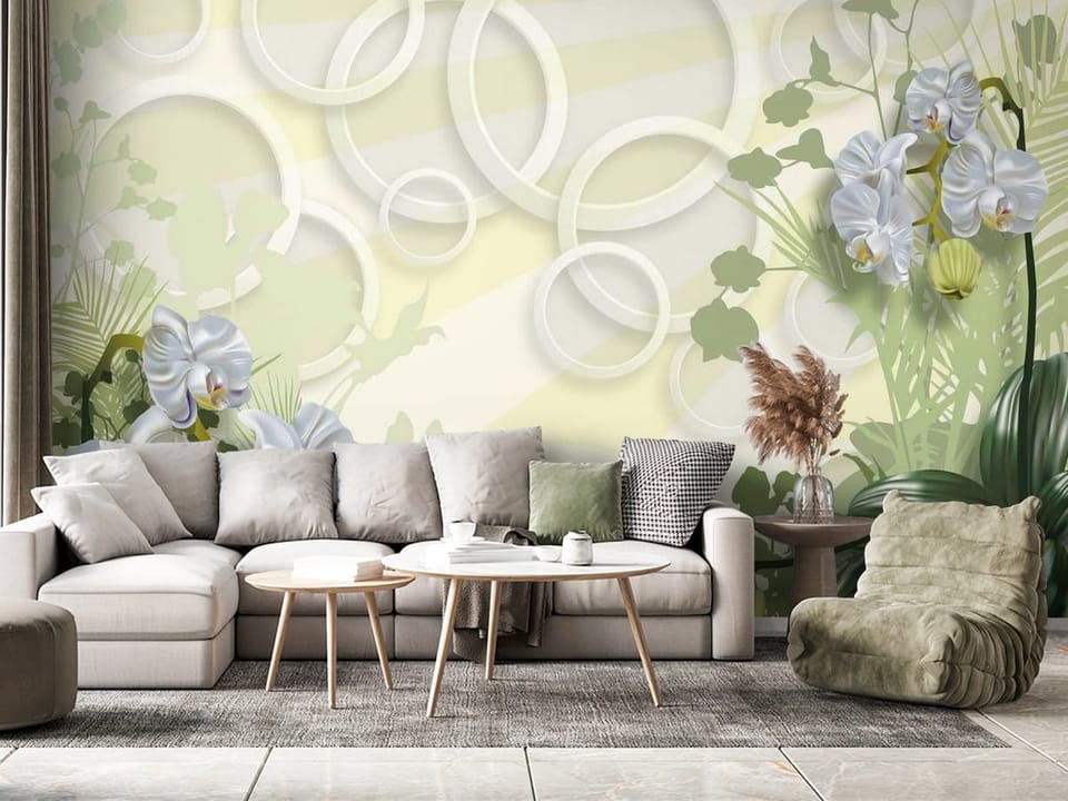Fototapeta z białymi orchideami i zielonymi liśćmi na pastelowym tle - nowoczesny salon z różnymi dodatkami