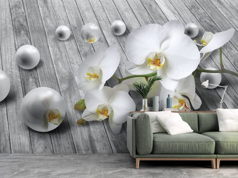 Fototapeta z białymi orchideami na tle szarych desek z perłowymi kulami - ściana w salonie z dużą przestrzenią