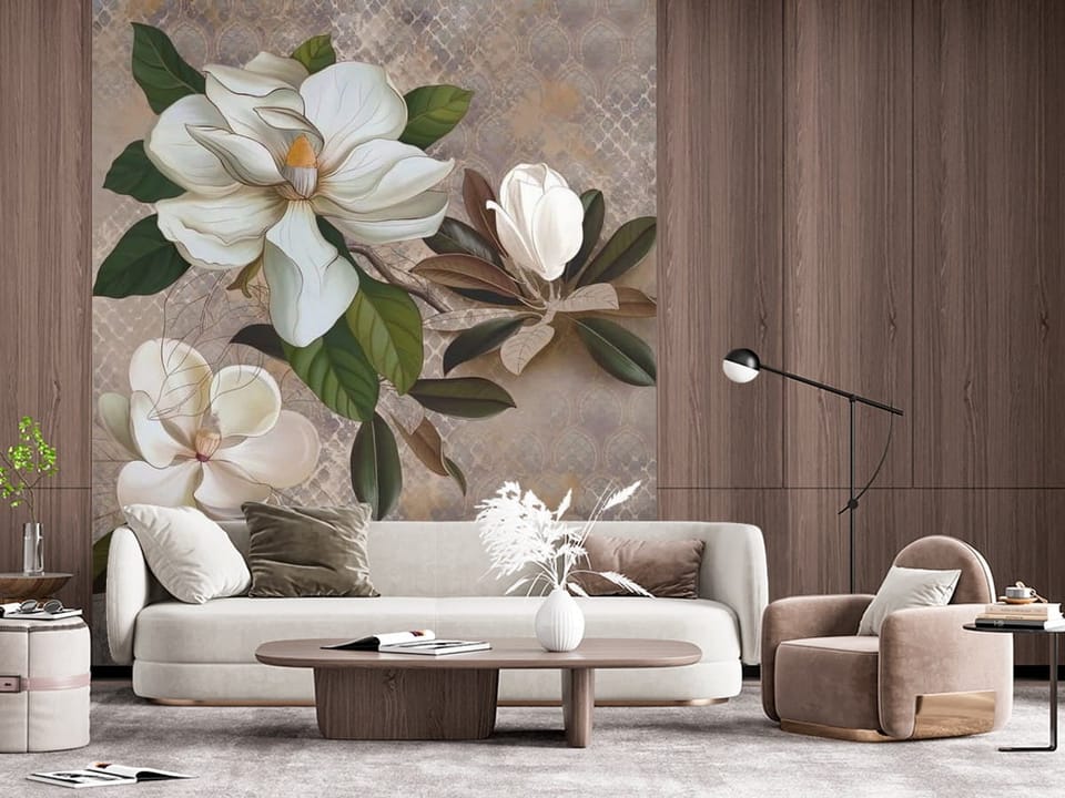 Fototapeta z dużymi białymi kwiatami magnolii i zielonymi liśćmi na beżowym tle - ściana w połączeniu z drewnem w salonie