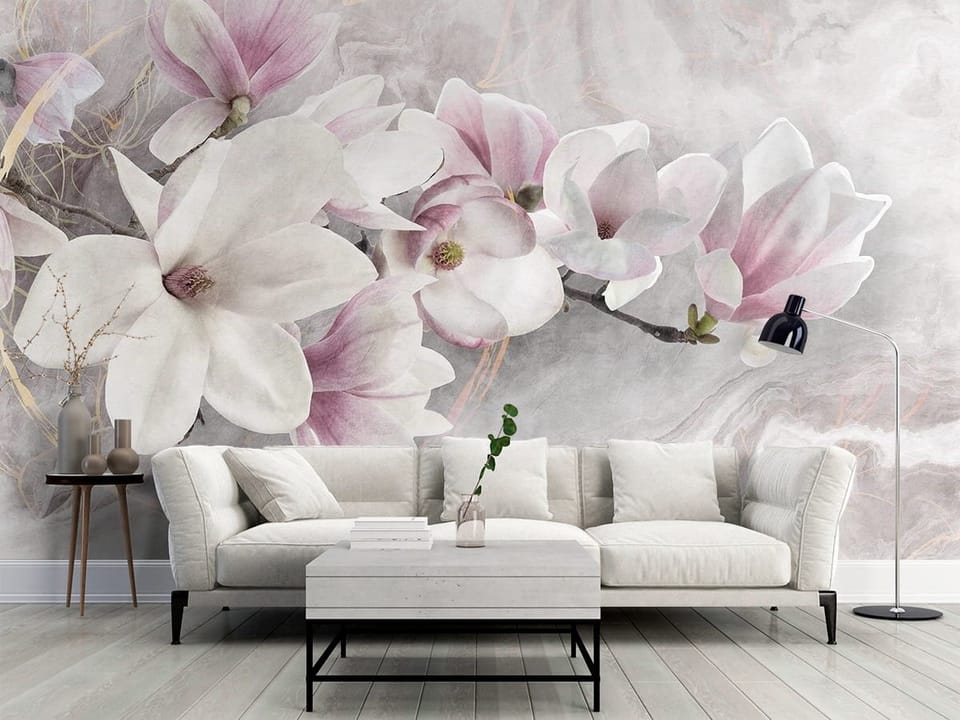 Fototapeta z gałęzią i dużymi kwiatami magnolii na rozmytym tle - klasyczny salon w szarych kolorach