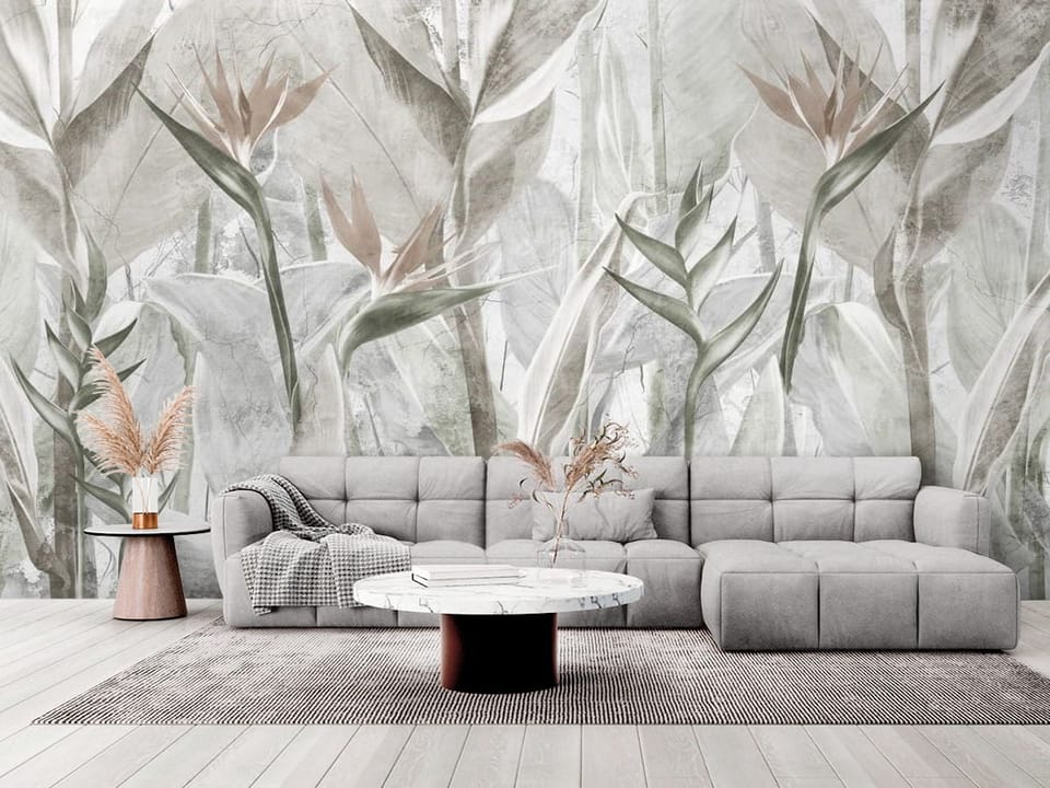Fototapeta z dużymi liśćmi i kwiatami tropikalnymi w odcieniach zieleni - elegancki salon w stylu minimalistycznym