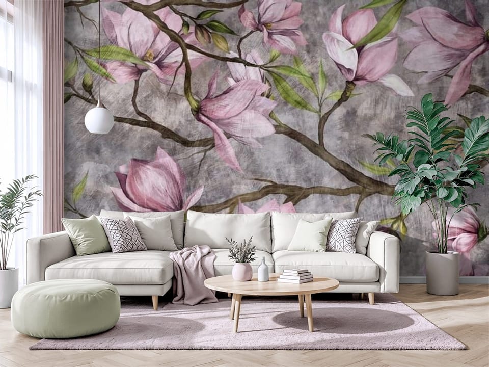 Fototapeta z gałązkami drzewa i różowymi kwiatami magnolii na szarym tle - salon w jasnych barwach z modnym akcentem