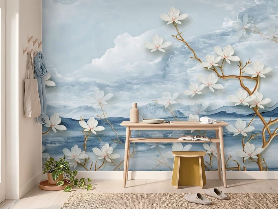 Fototapeta z białymi kwiatami magnolii, brązowymi gałęziami i górami w tle - inspiracja do przytulnego przedpokoju