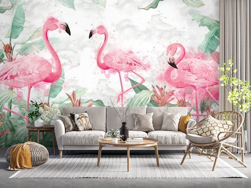 Fototapeta z trzema różowymi flamingami otoczonymi zielenią i kwiatami - salon z naturalnymi dodatkami