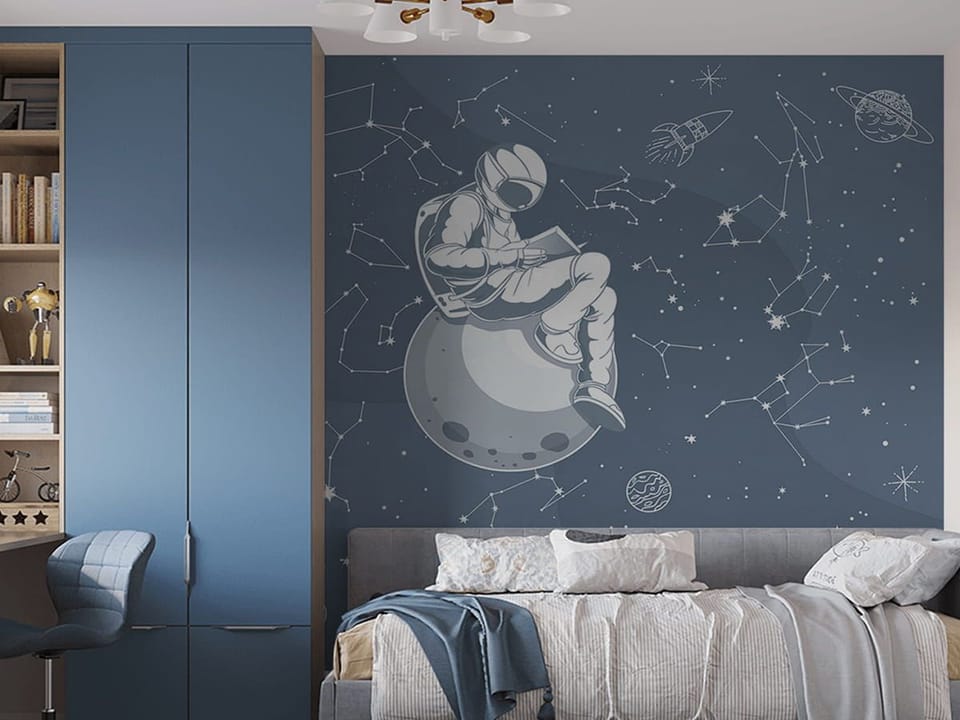 Fototapeta Astronauta na planecie z książką - aranżacja w pokoju nastolatka