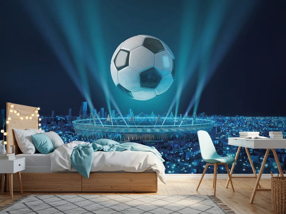 Fototapeta przedstawiająca dużą piłkę nożną unoszącą się nad oświetlonym stadionem z miastem w tle - jasny pokój nastolatka