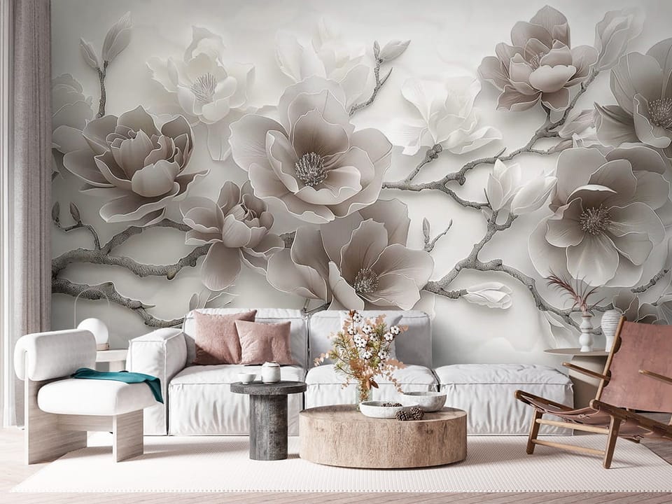 Fototapeta z dużymi kwiatami magnolii na jasnym tle - kompozycja ściany z nowoczesną kanapą w salonie