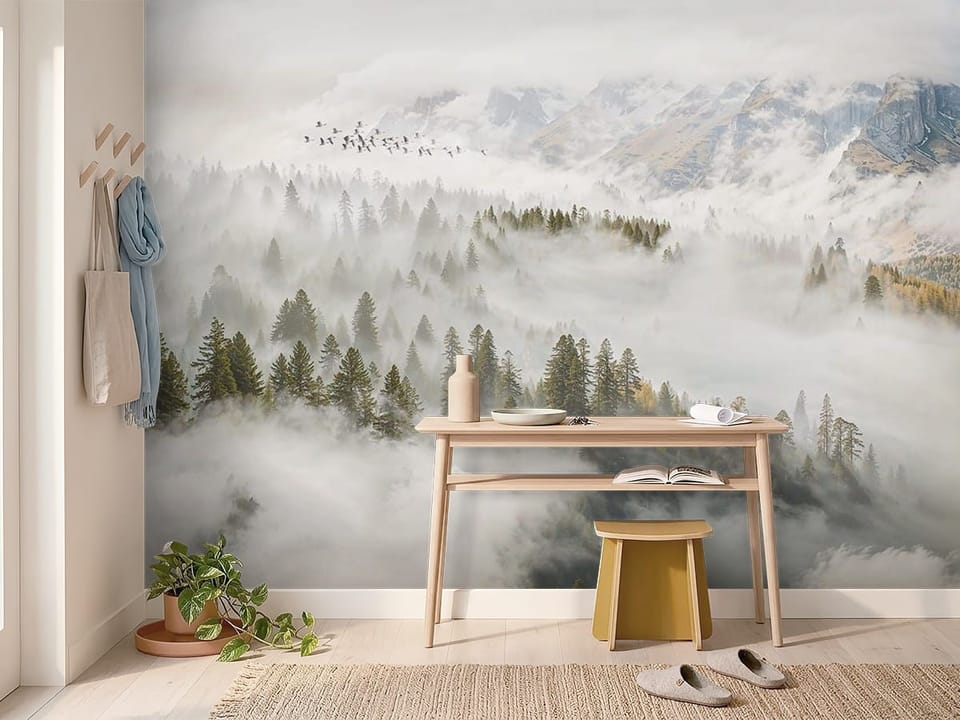 Fototapeta przedstawiająca gęsty las iglasty spowity mgłą z górami w tle. - inspiracja do przytulnego przedpokoju